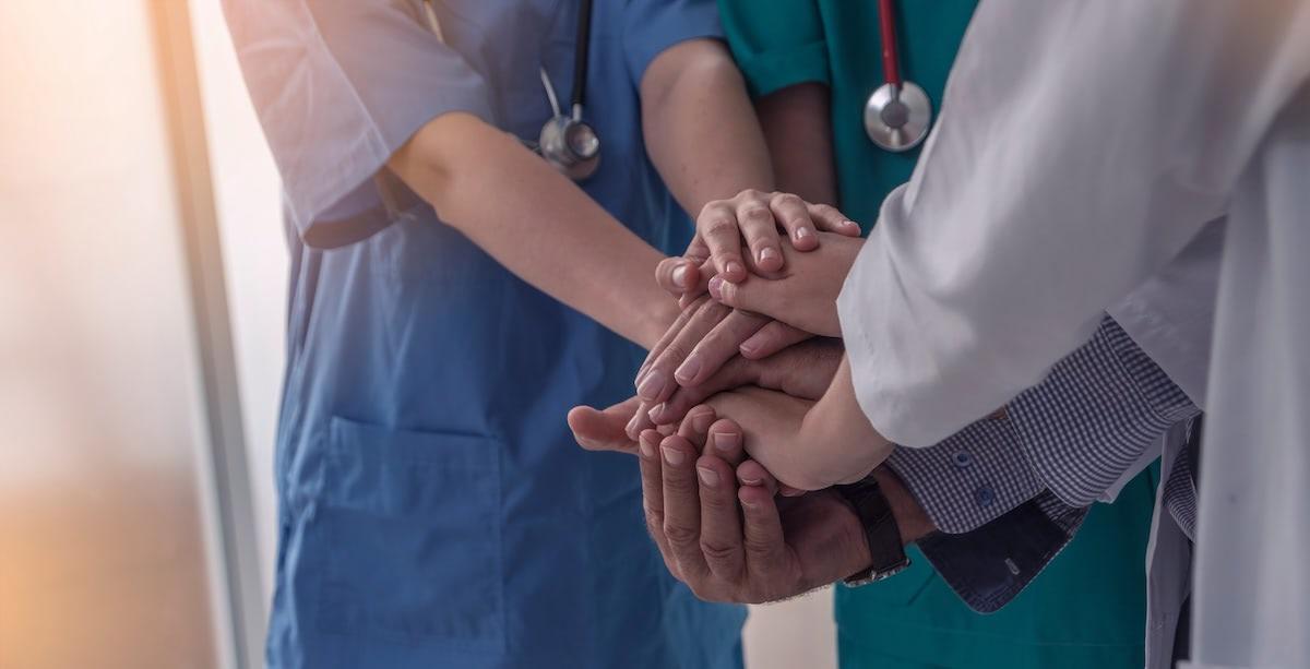 Nurses holding hands