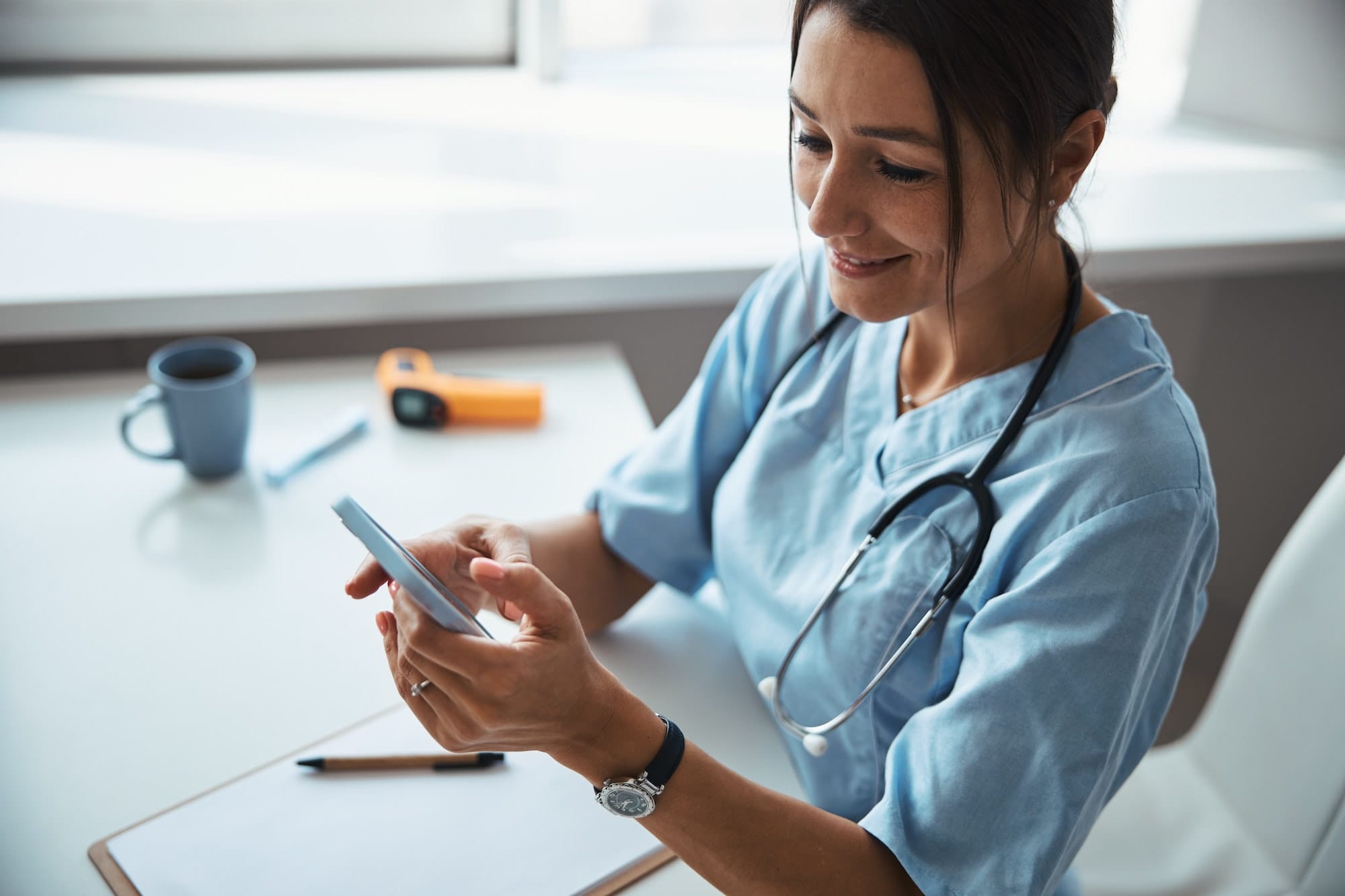 Nurse using mobile phone